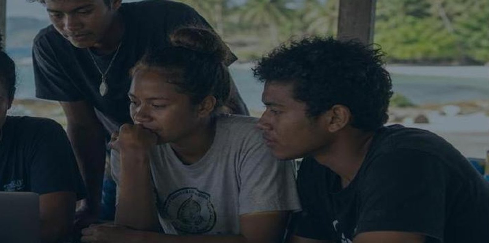 Local ocean storytellers reviewing footage together